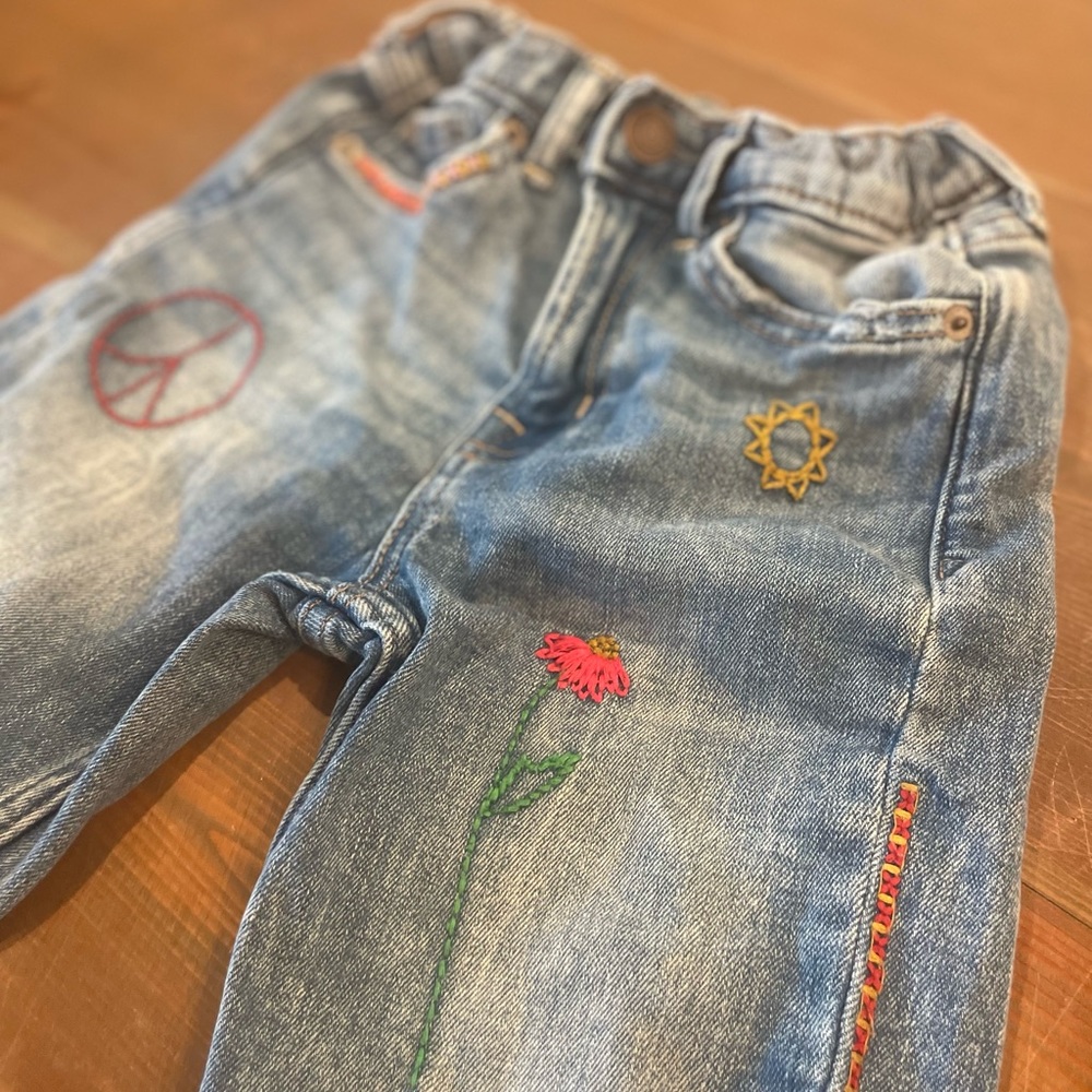 Super cute embroidered peace jeans